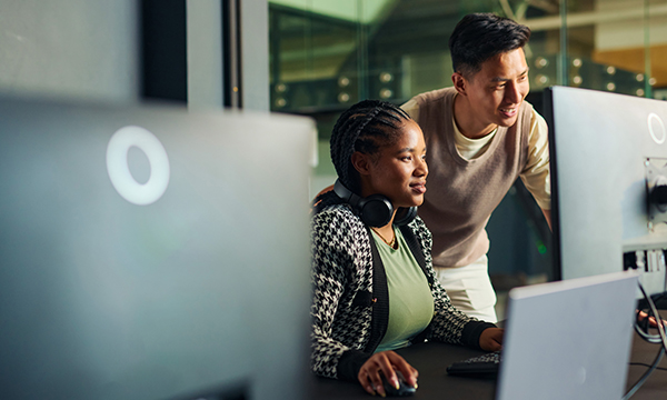 An image of a woman and man looking at a computer screen
